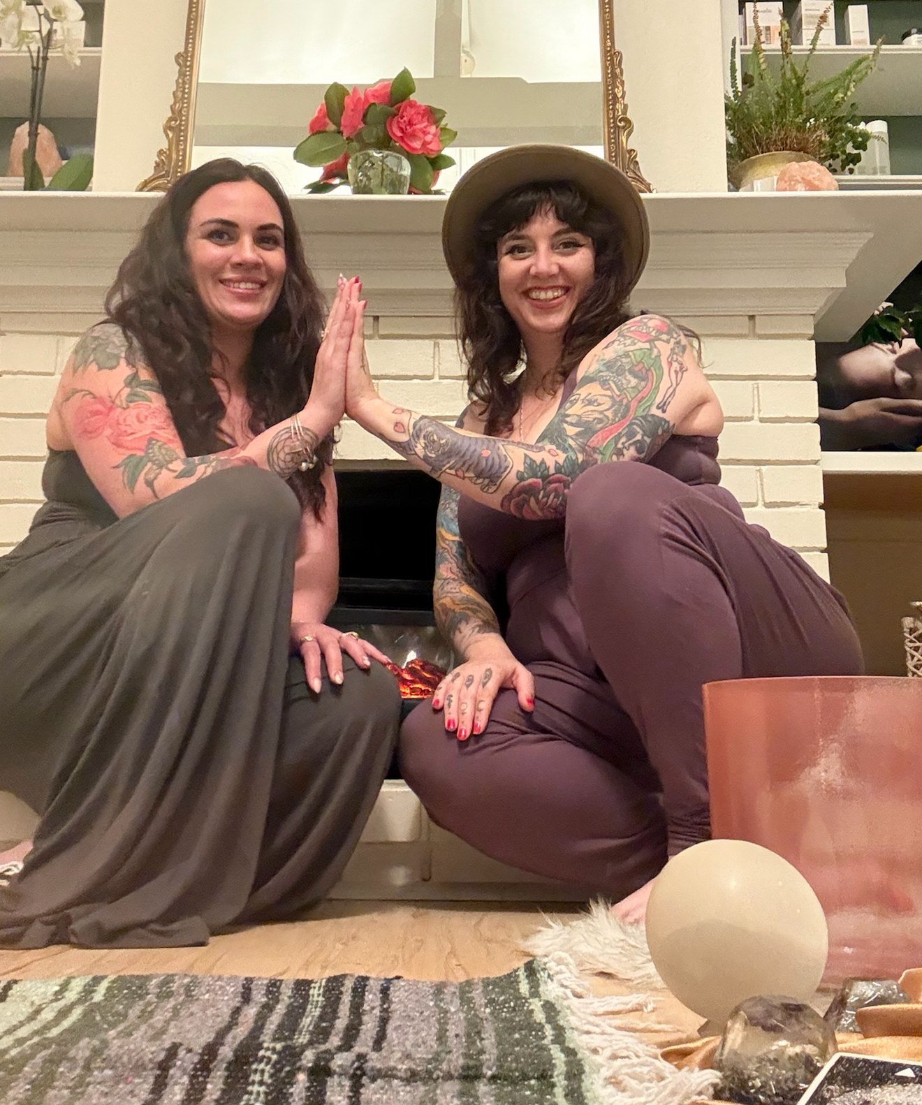 Melissa and Nicola Buffa in the studio before a SoulBeauty Soundbath and Reiki evening, palms together beside the crystal singing bowls